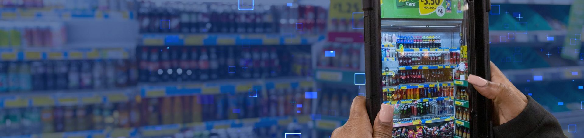A person using a device to capture an image of a retail shelf displaying various beverages, illustrating in-store compliance and promotional effectiveness in FMCG.