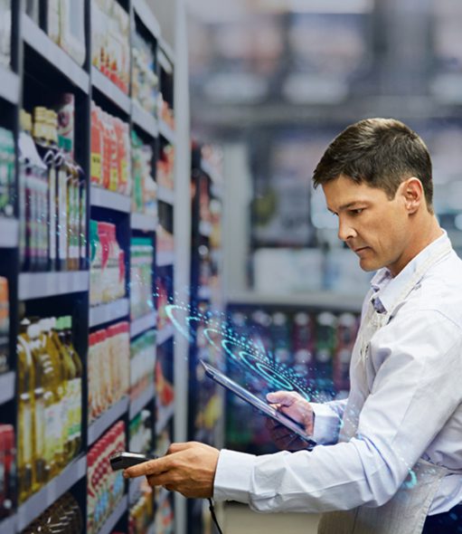 A field marketing professional using a tablet and scanning products in a grocery store aisle, showcasing effective retail execution strategies for FMCG brands.