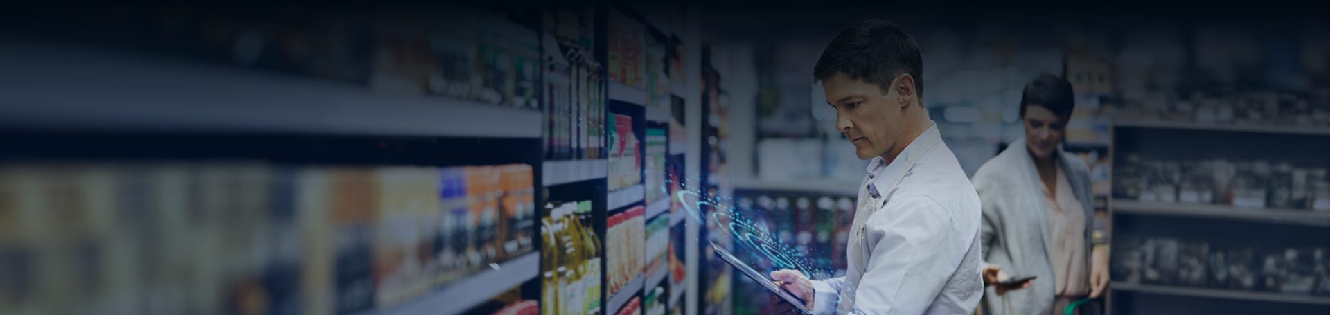A retail execution team member utilizing digital tools for product visibility and compliance in a supermarket aisle.